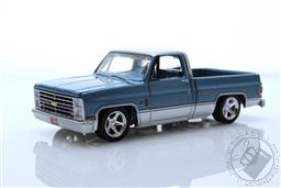 Auto World Premium - 2023 Release 2B - 1985 Chevrolet Silverado Pickup Truck (Lowered Version) in Light  Blue Poly with Silver Lower Sides and Roof,Auto World